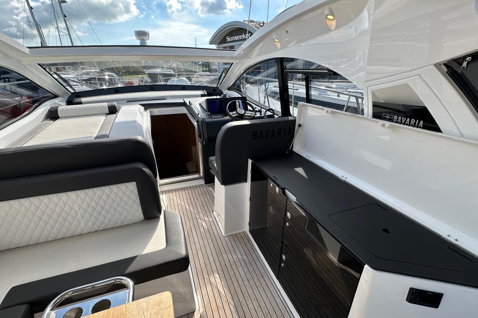 2023 Bavaria SR41 yacht interior with sleek seating and modern helm station.