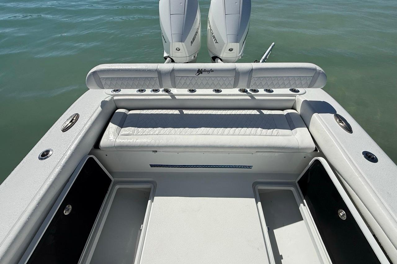 2017 Yellowfin 26 Hybrid boat interior with seating and dual Mercury engines.