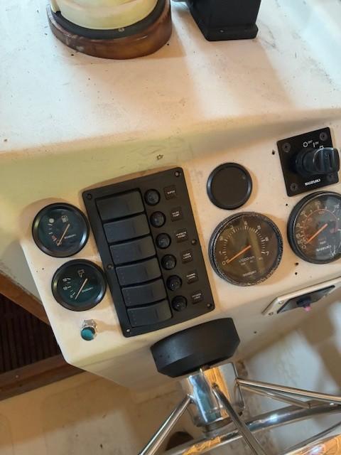 1990 Custom North End Composites Point boat dashboard with gauges and controls.