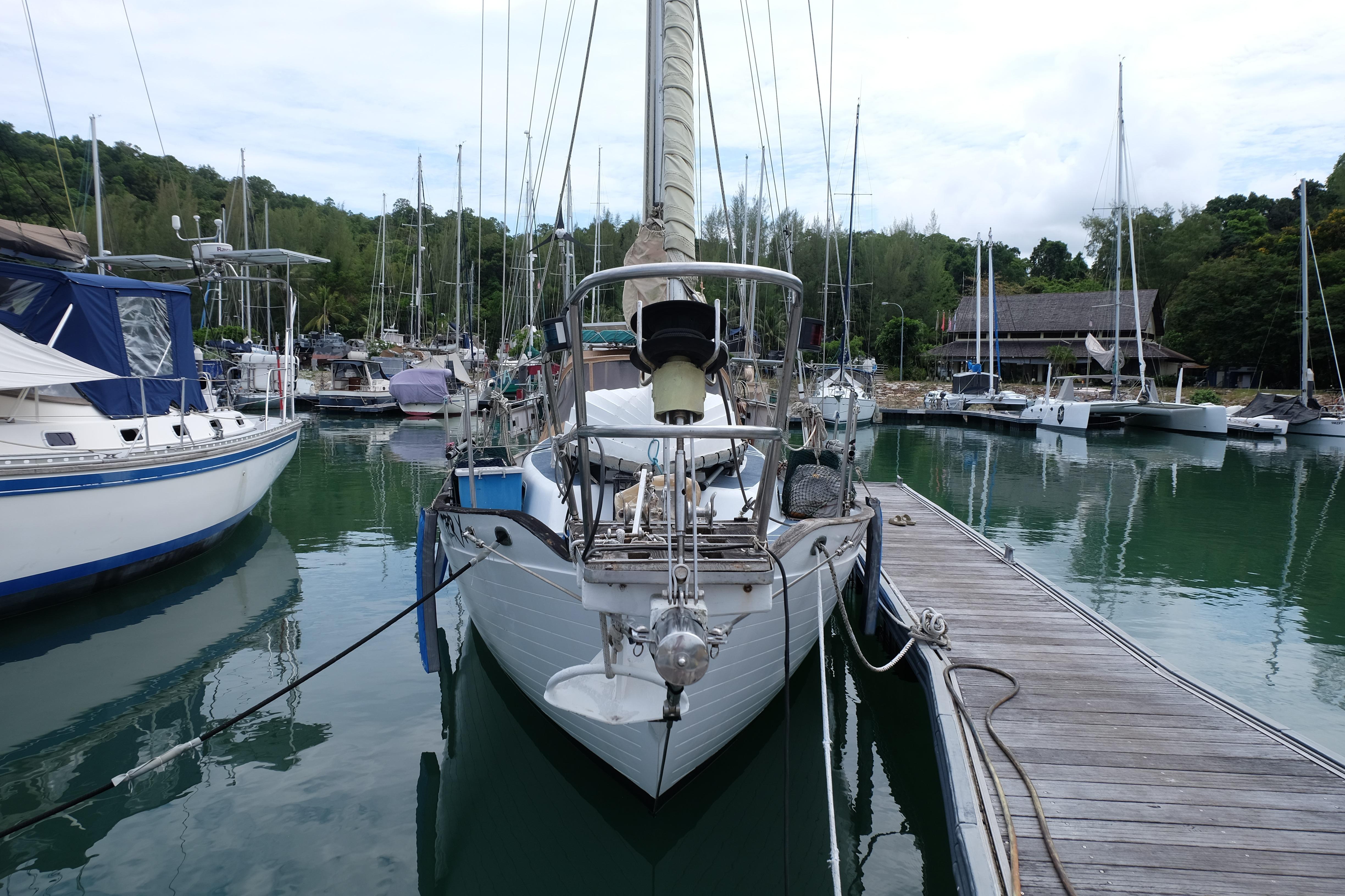1979 Westwind 35 sailboat docked in a serene marina setting.