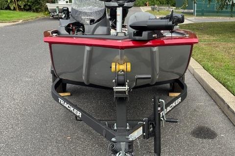 2026 Tracker Pro 170 boat on trailer, parked on asphalt road.