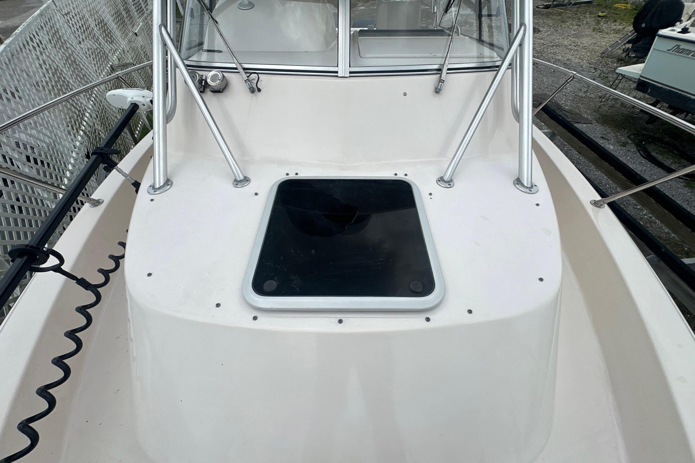 2006 Grady-White Marlin 300 boat deck with hatch and railing.