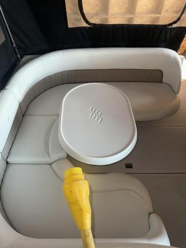2005 Four Winns 298 Vista boat interior with white seating and table.