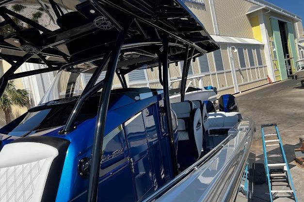 2022 Nor-Tech 390 Sport Center Console boat with sleek blue and white design.