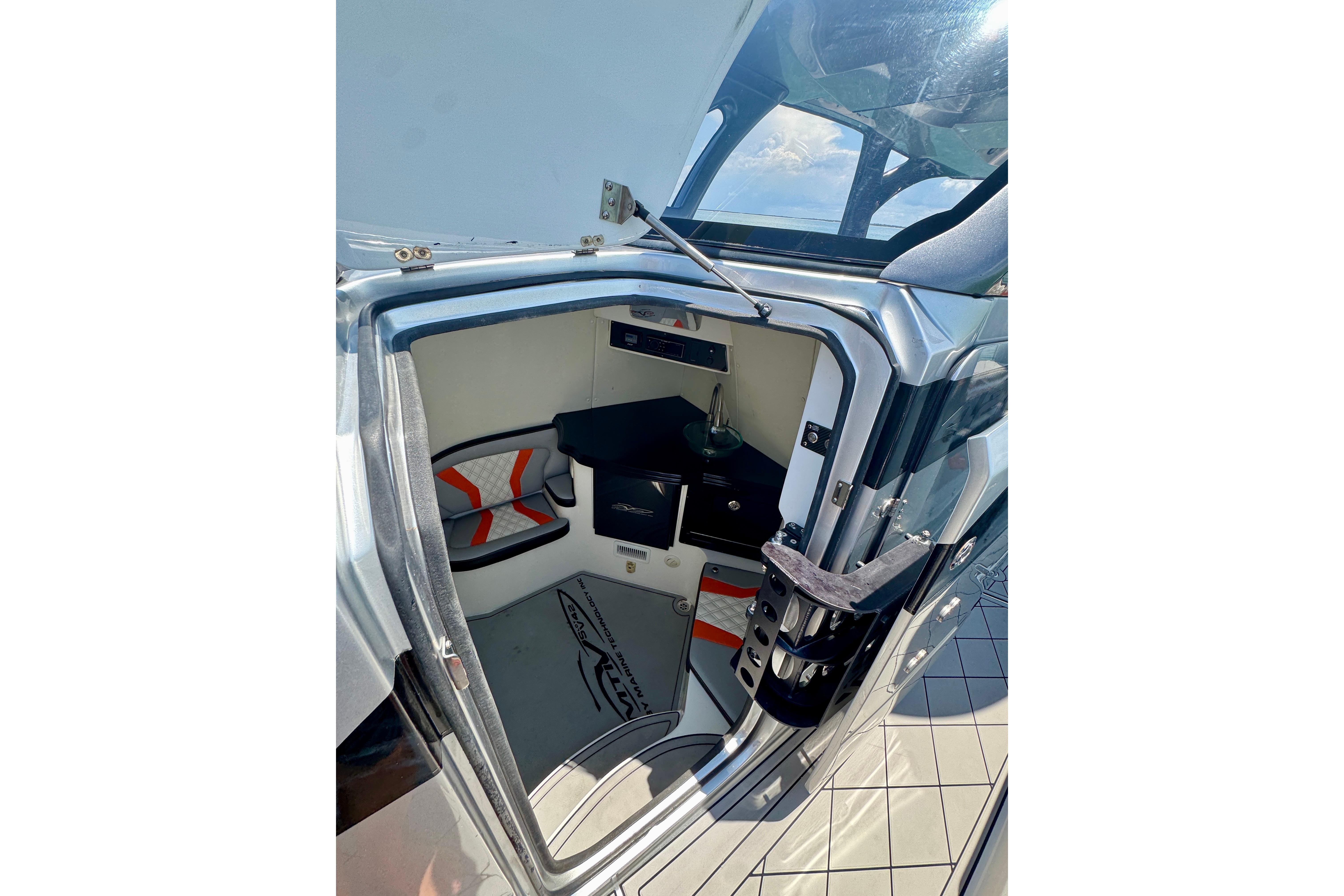 Interior view of 2017 MTI V42 boat cabin with modern design and seating.