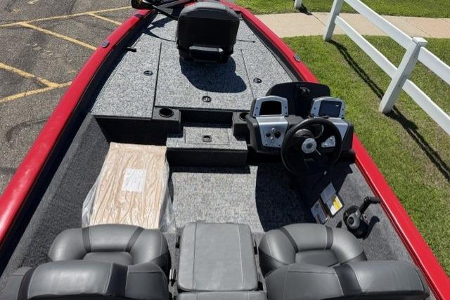 2026 Tracker Pro Team 175 boat interior with steering console and seating.