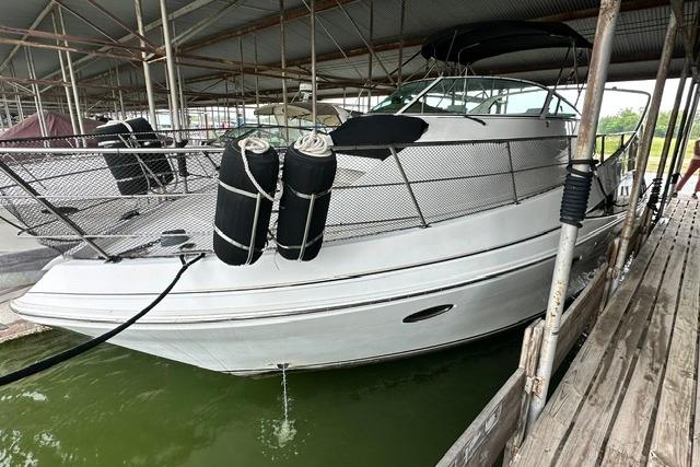 2004 Carver 360 Mariner docked in a covered marina.