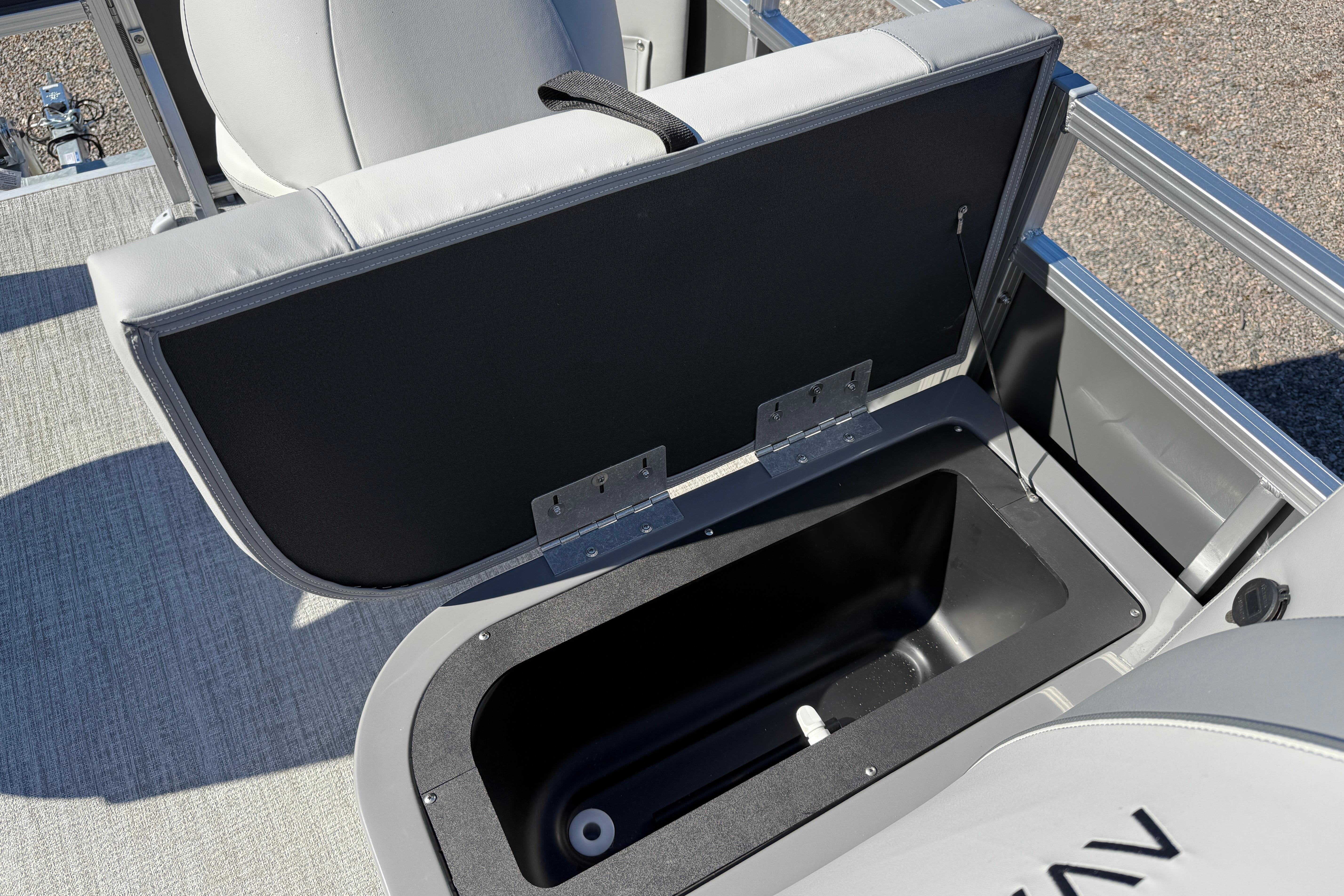Open storage compartment in 2026 Avalon VENTURE 85 QUAD boat, featuring sleek design and functionality.