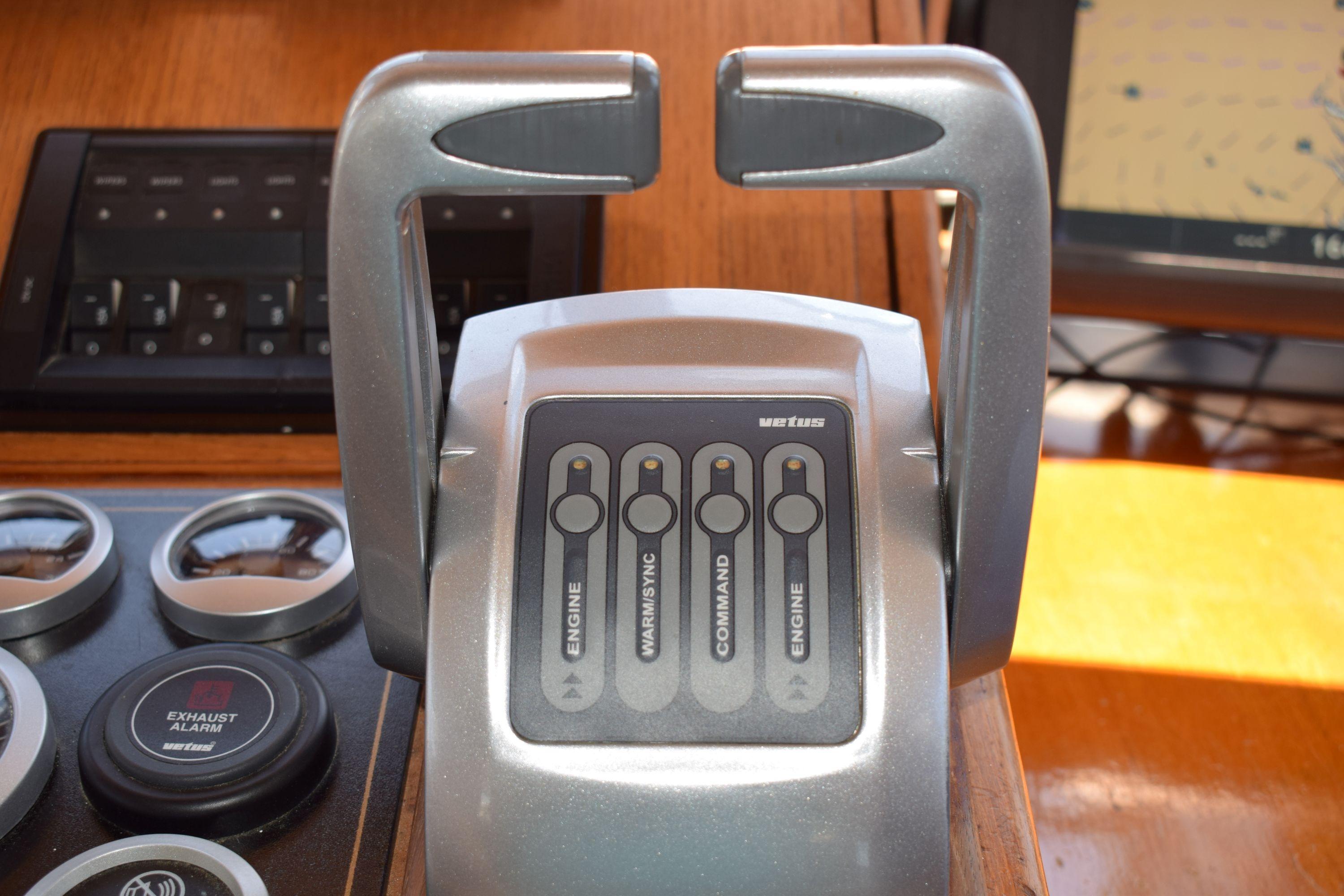 Control panel of a 1980 Cheoy Lee 52 Motorsailer with engine and command switches.
