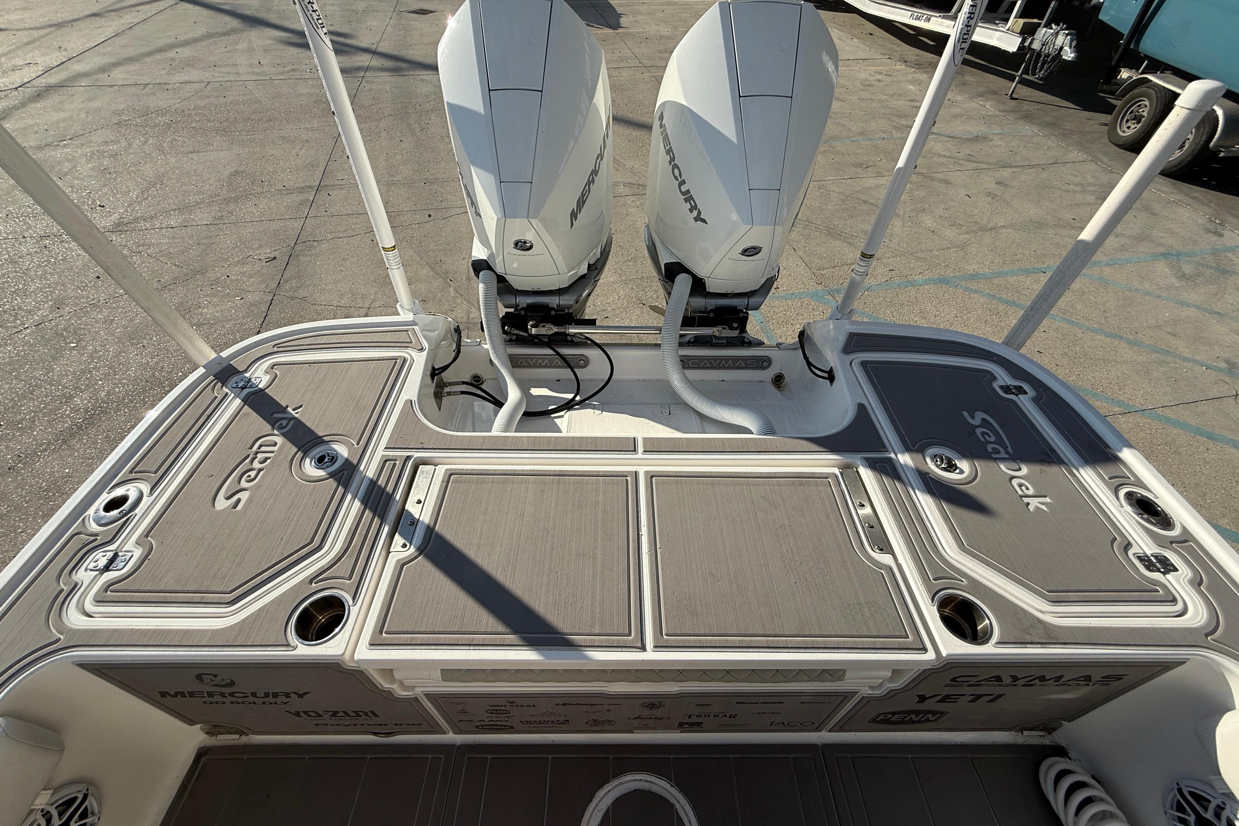 2022 Caymas 28 HB Twin boat with dual Mercury engines and SeaDek flooring.