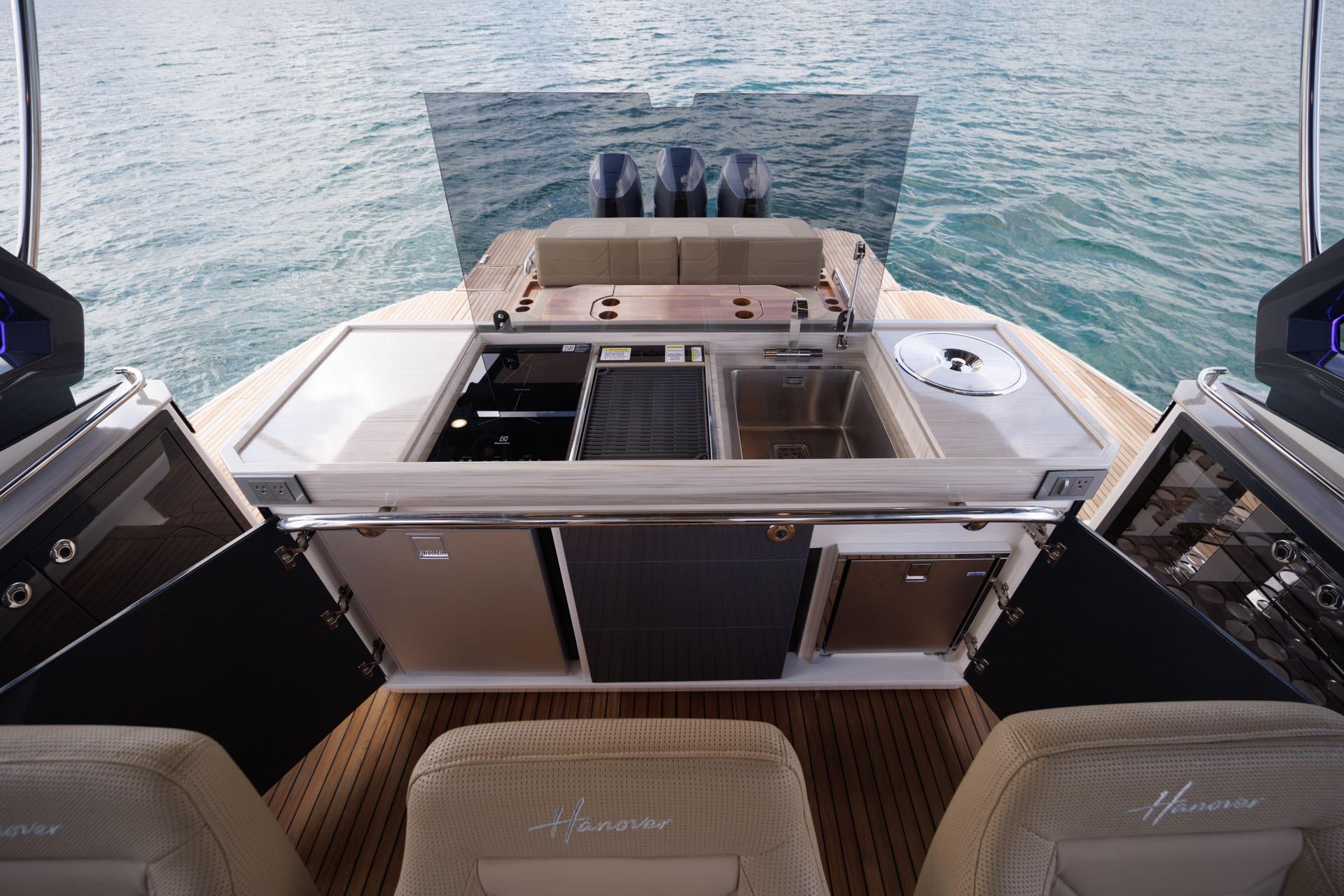 Luxury Hanover 447 yacht interior with modern kitchen, 2026 model, overlooking serene ocean waters.