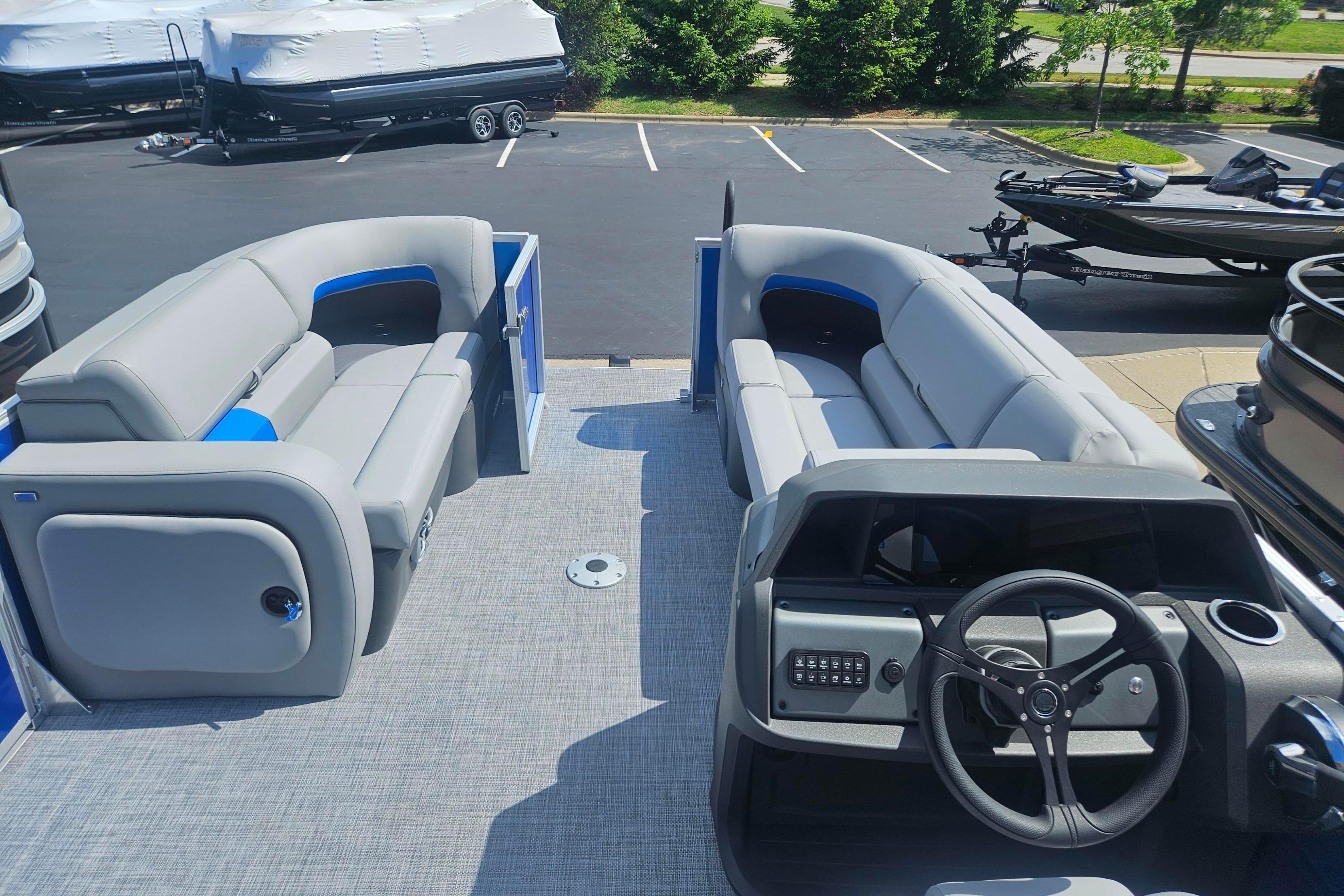 2026 Sun Tracker Party Barge 22 RF DLX pontoon boat with spacious seating and modern helm.