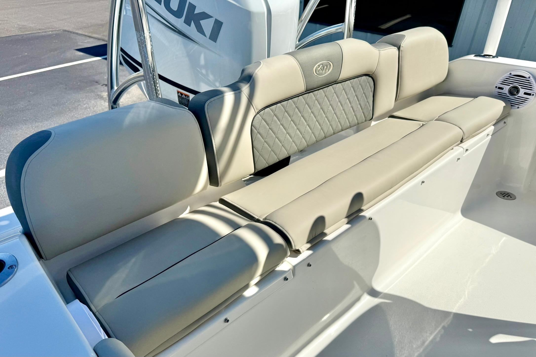 2026 Key West 189 FS boat seating with Suzuki engine, featuring comfortable beige upholstery.