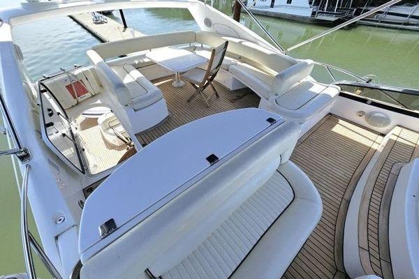 Luxurious 2005 Sunseeker Manhattan 66 yacht with spacious deck and elegant seating.