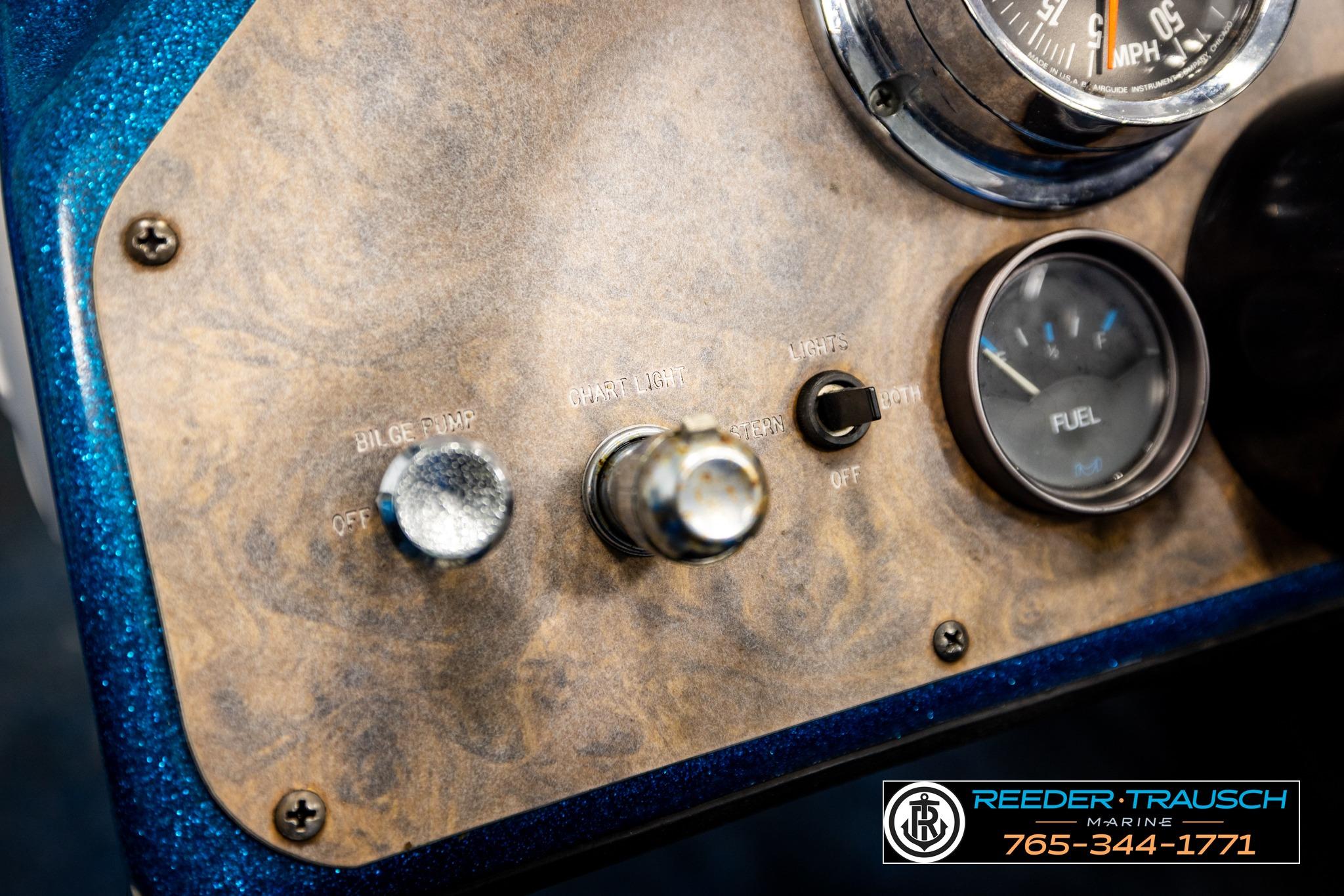 Dashboard of a 1980 Ranger 175 VS boat with fuel gauge and controls.