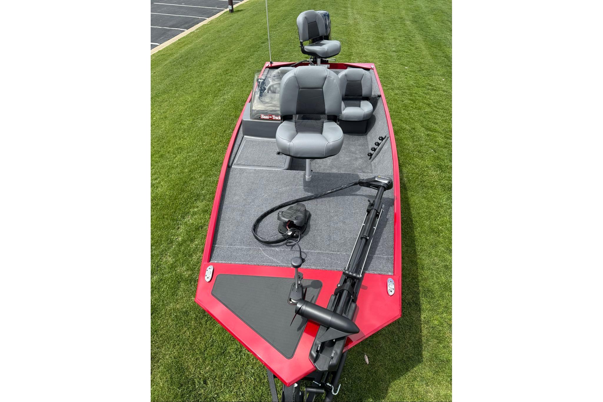 2026 Tracker Bass Tracker Classic XL boat on grass, featuring dual seats and trolling motor.