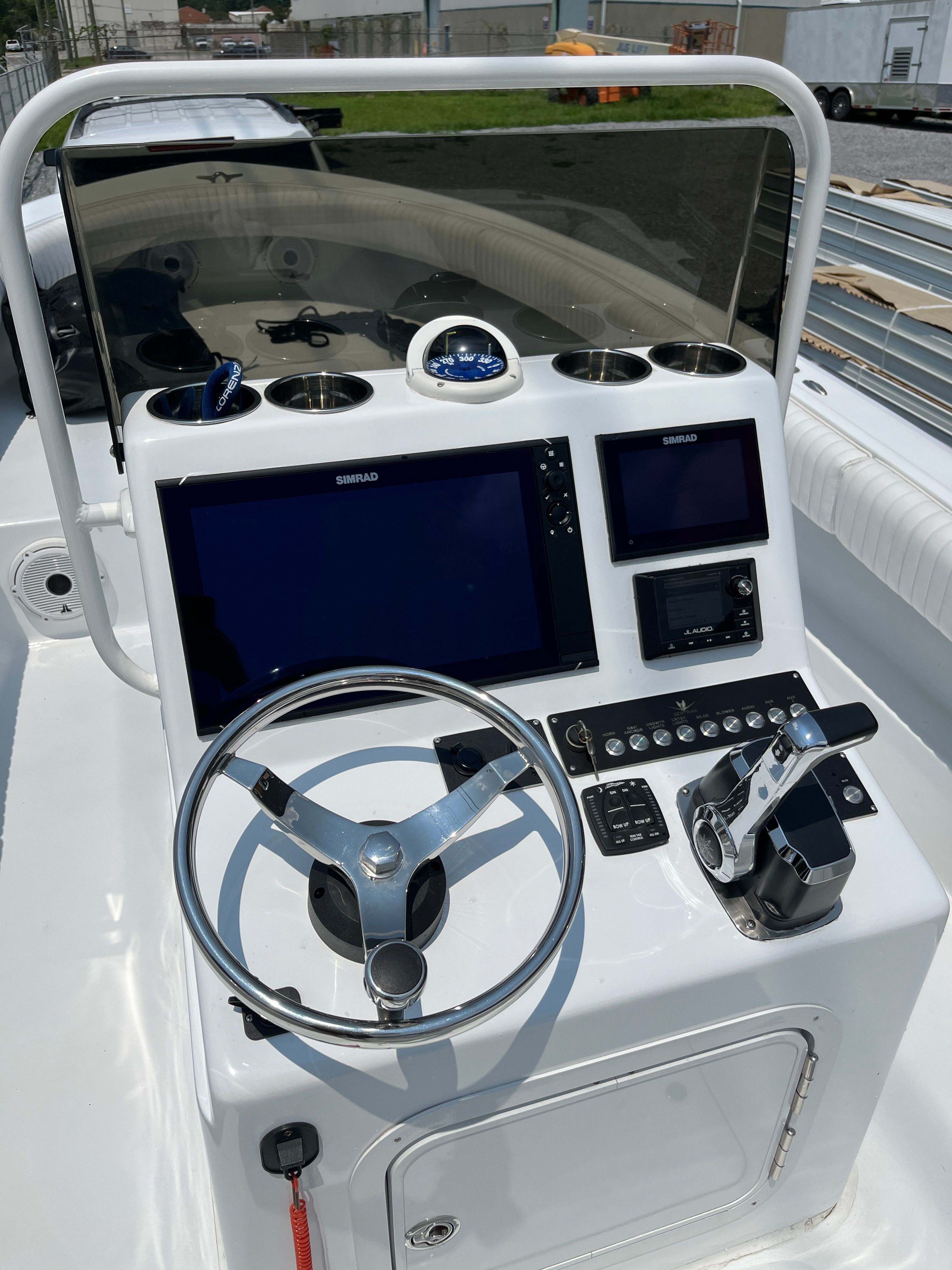 1970 Bertram Sportsman boat console with modern electronics.