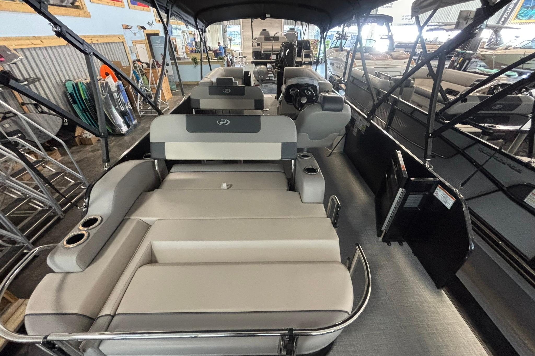 2024 Princecraft Quorum 23 RL pontoon boat interior with luxurious seating and modern design.