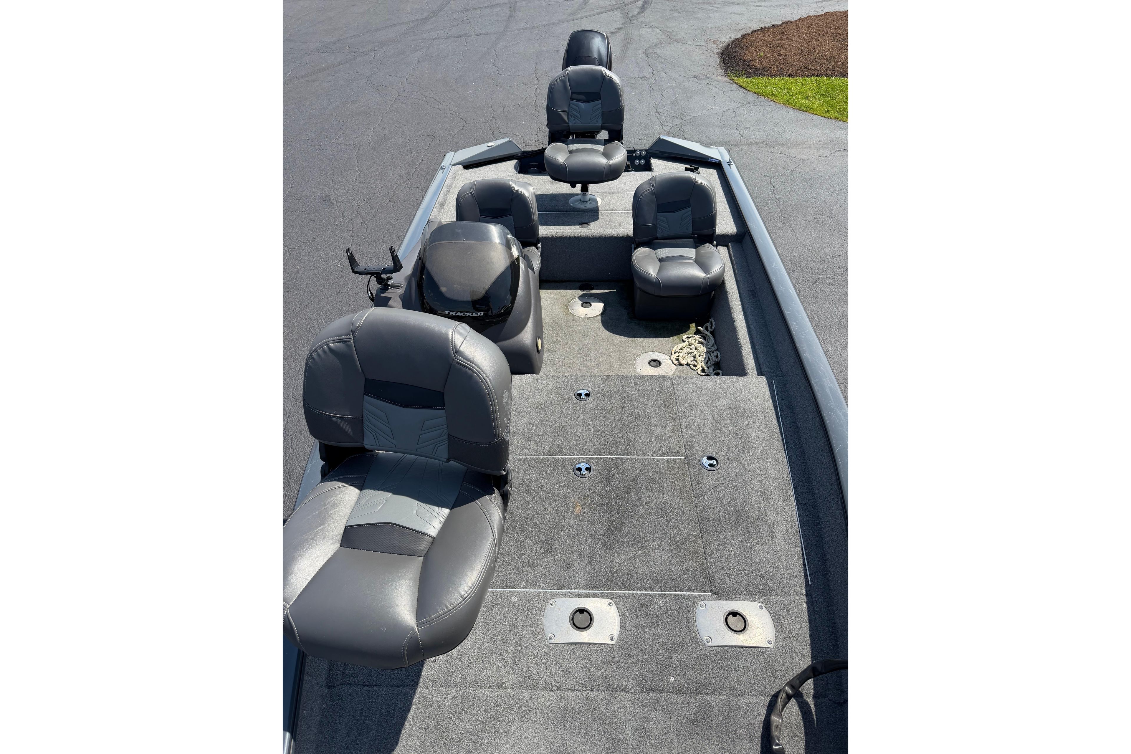 2019 Tracker Pro Team 175 TF boat interior with seating and carpeted deck.
