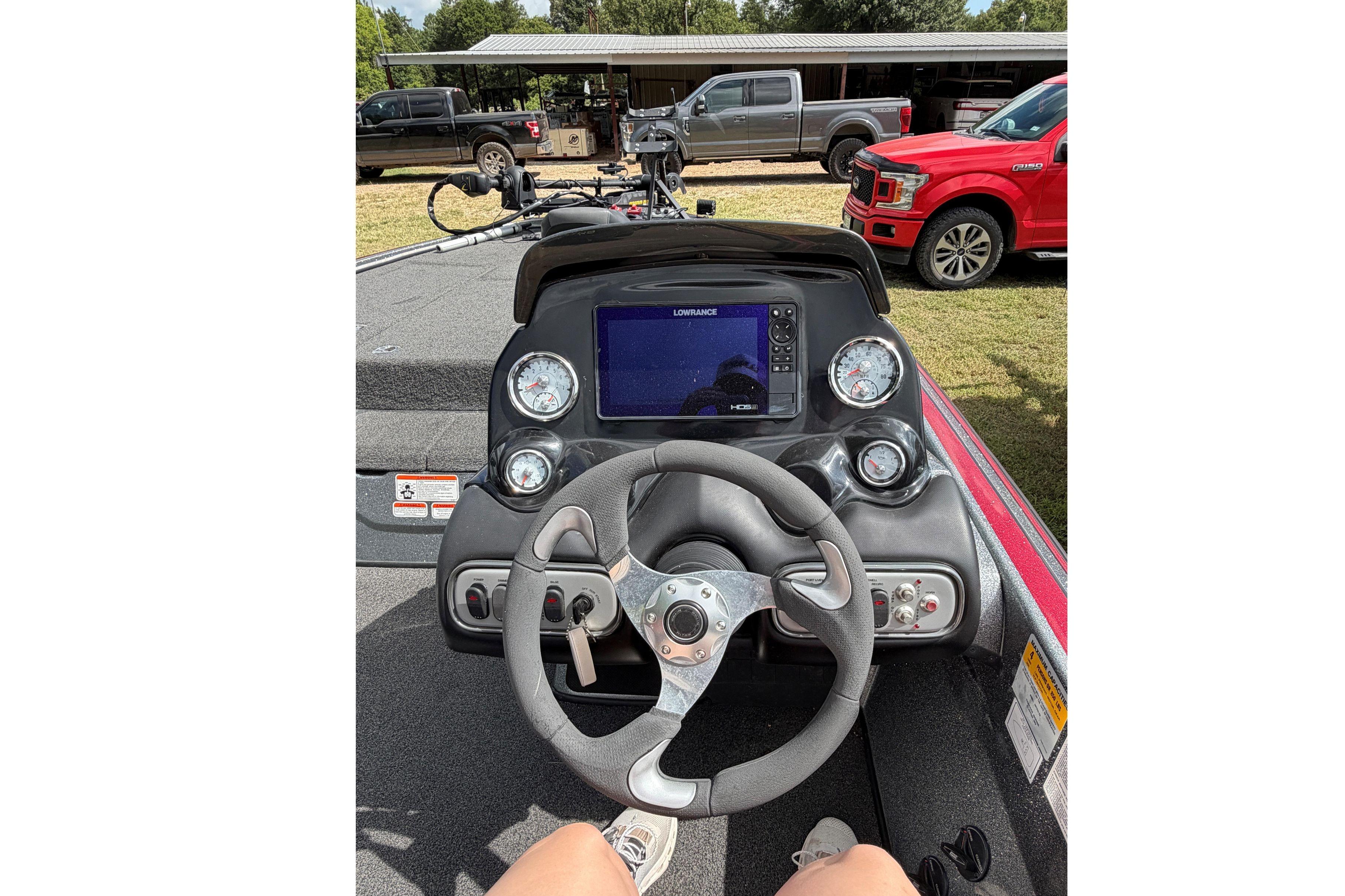 The image shows the cockpit of a 2015 Nitro Z-8 boat with a modern helm.