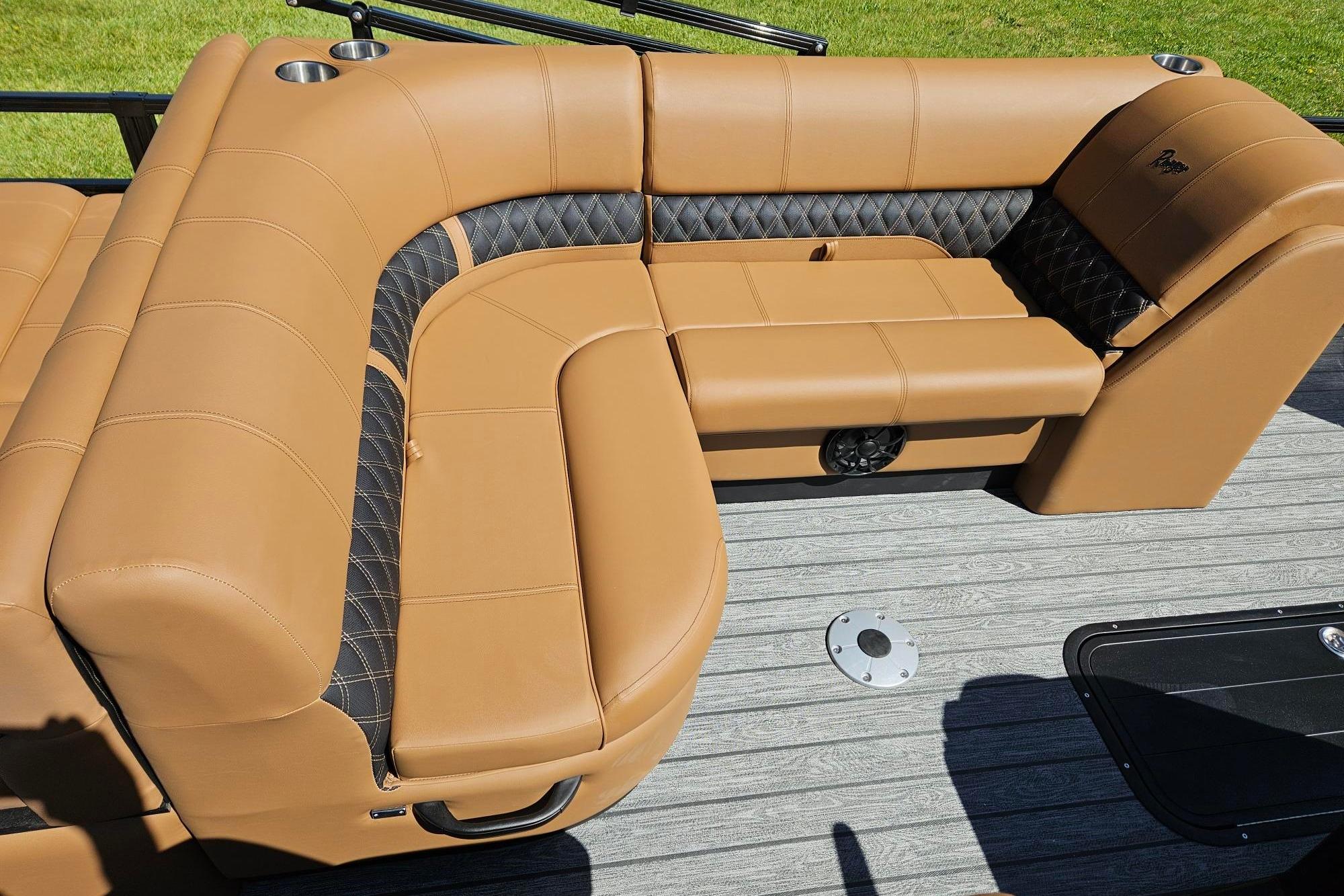 Luxurious tan seating on 2026 Ranger 223F boat, featuring quilted accents and cup holders.