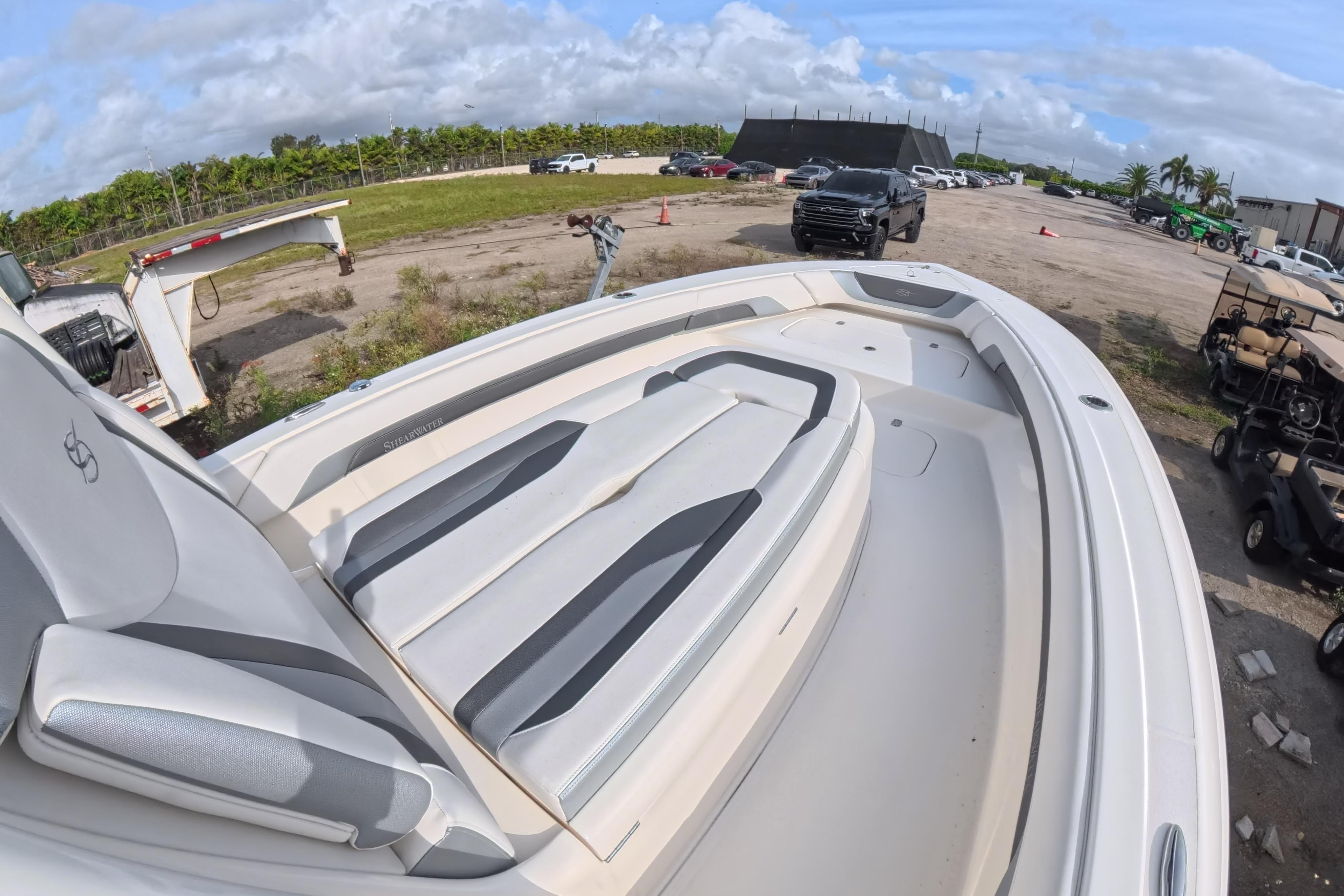 2023 ShearWater 270 Carolina Flare boat with sleek seating, parked outdoors.