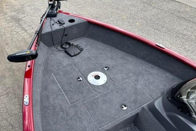 2025 Tracker Super Guide V-16 SC boat interior with carpeted deck and trolling motor.