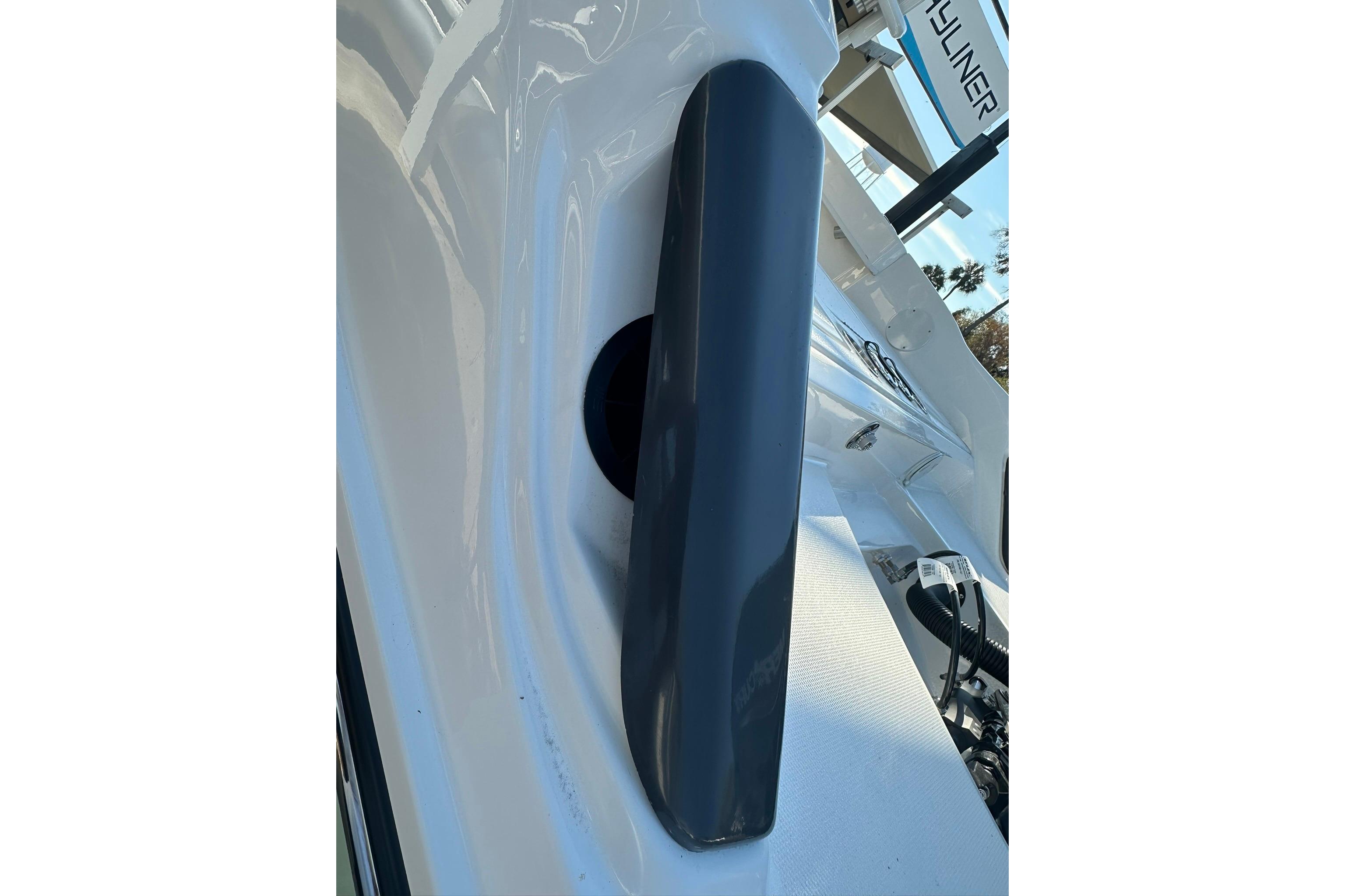 2026 Bayliner Trophy T20CC boat detail, featuring sleek white and black design elements.