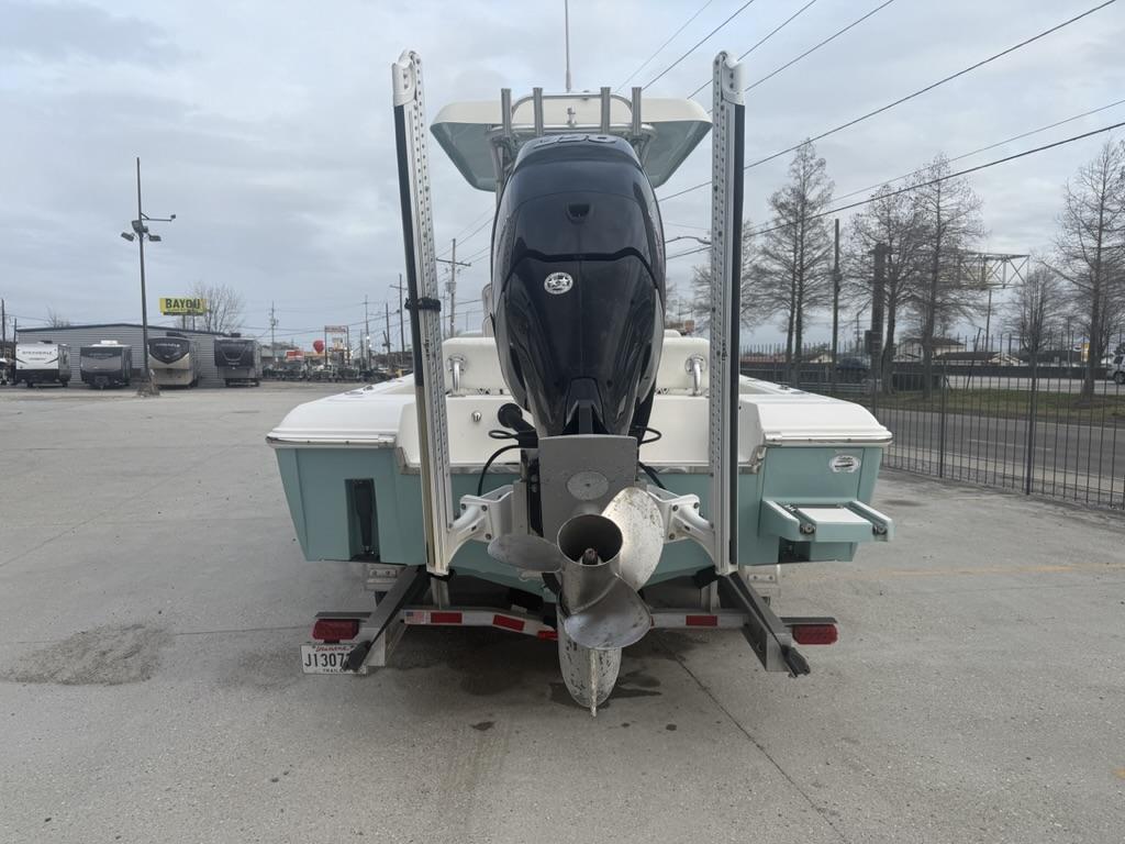 2017 ShearWater 270 Carolina Flare boat on trailer, rear view, in parking lot.
