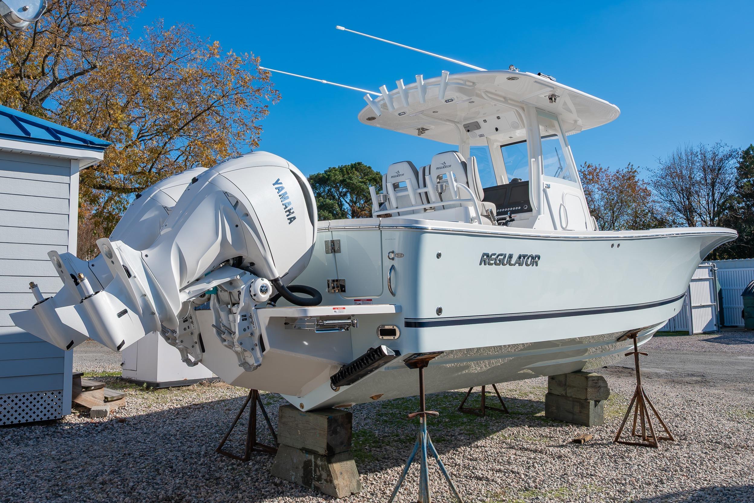 2026 Regulator 28 boat with Yamaha engine on display outdoors.
