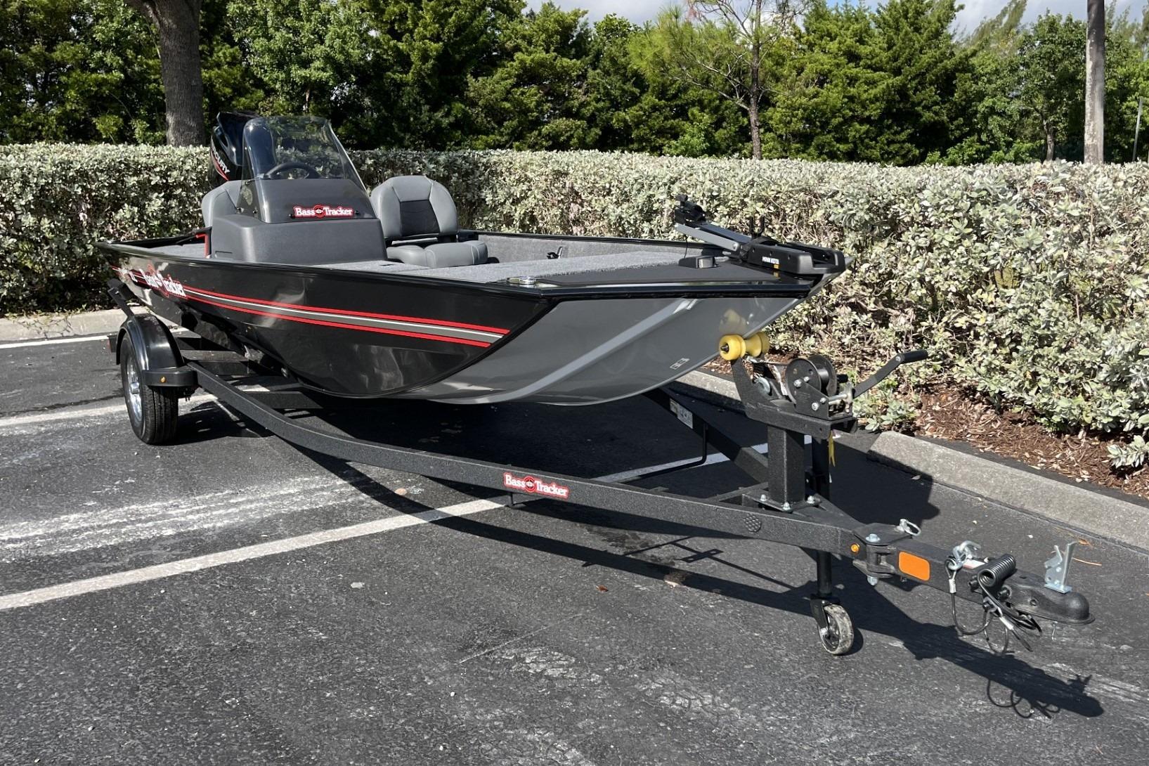 2026 Tracker Bass Tracker Classic XL boat on trailer in parking lot.