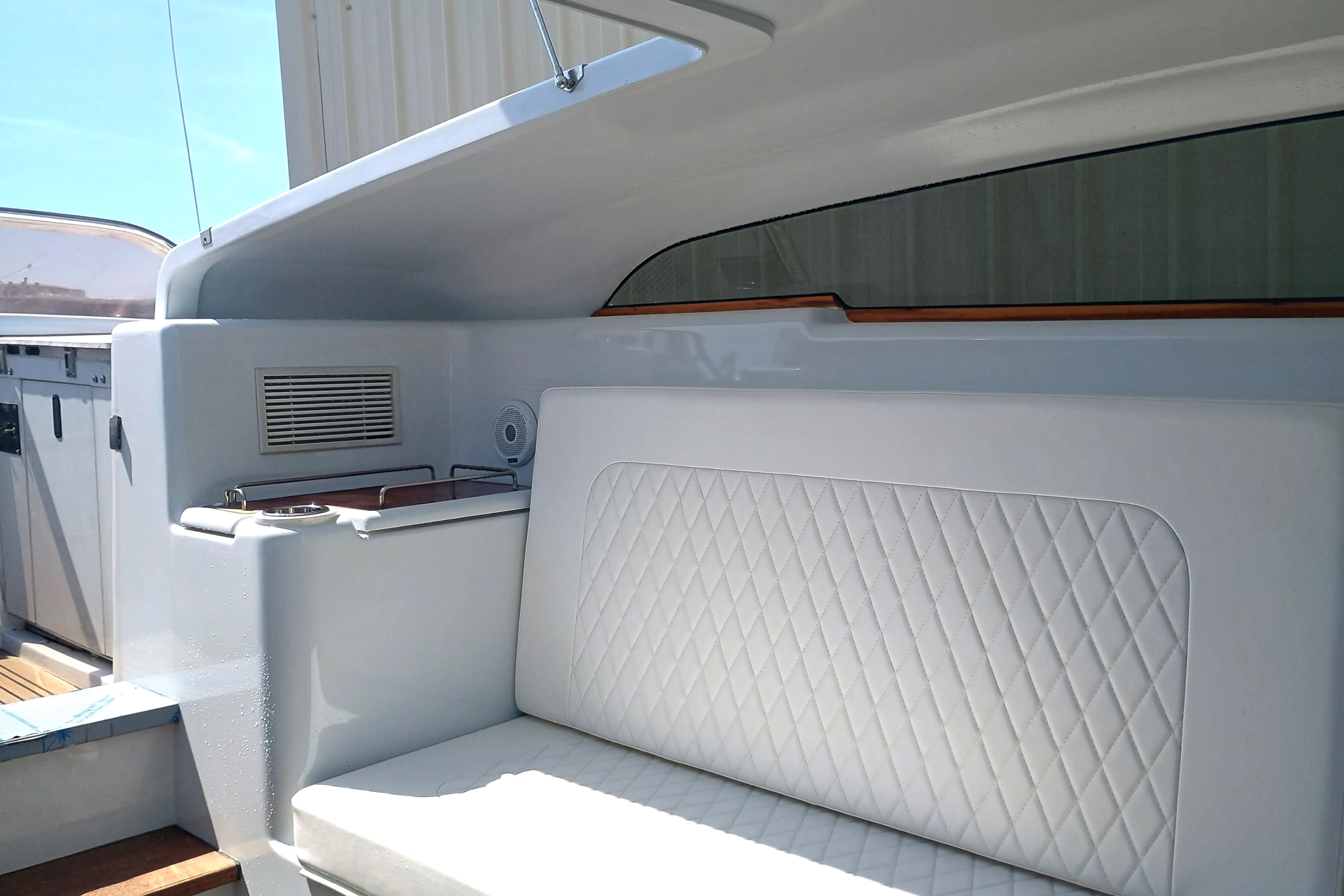 Luxurious 2006 Royal Denship Royal Limo yacht interior with quilted seating and sleek design.