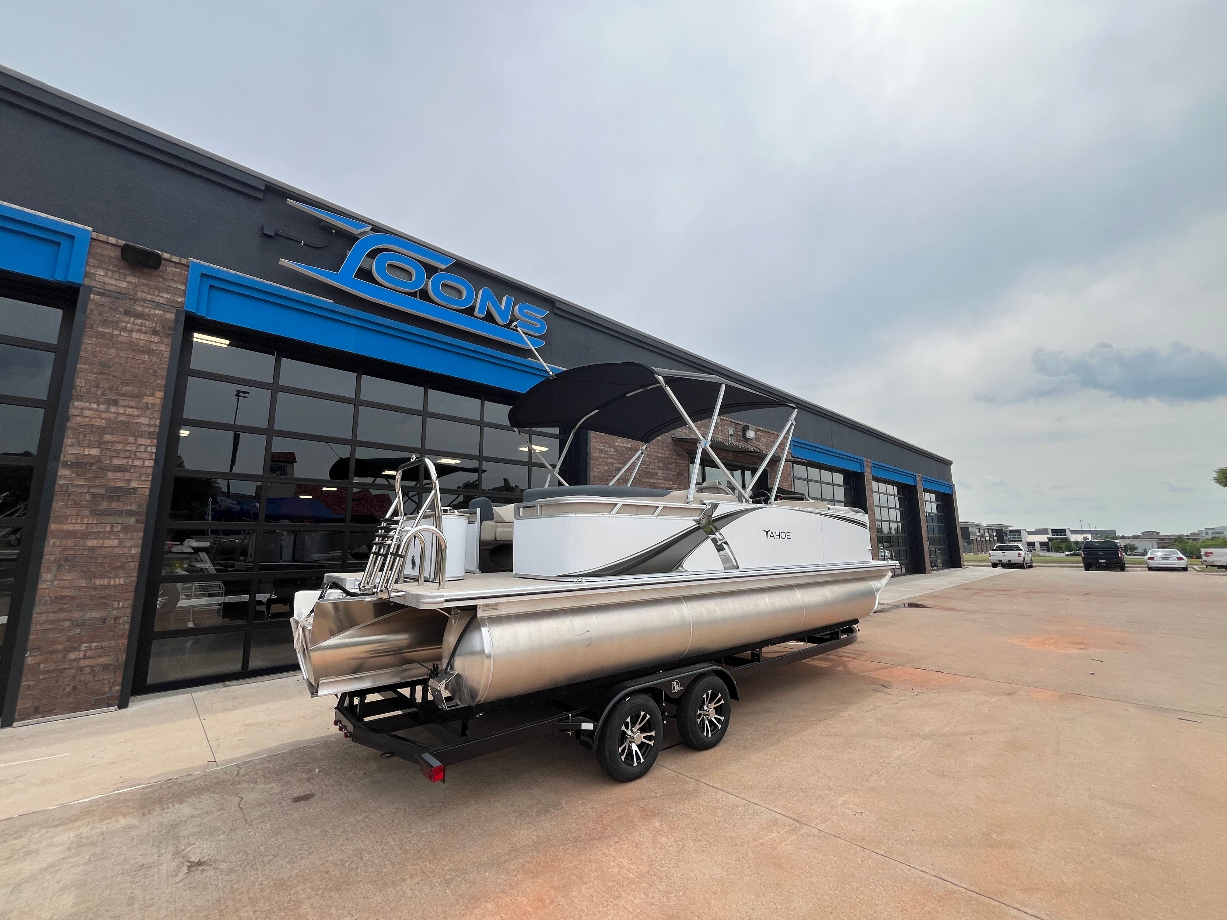 2025 Tahoe LTZ QL pontoon boat outside a dealership.