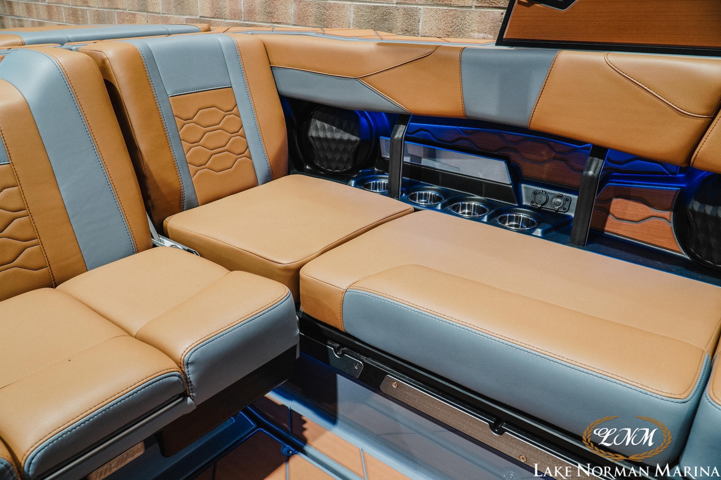 Luxurious interior seating of 2026 Malibu Wakesetter 23 LSV boat with tan and gray upholstery.
