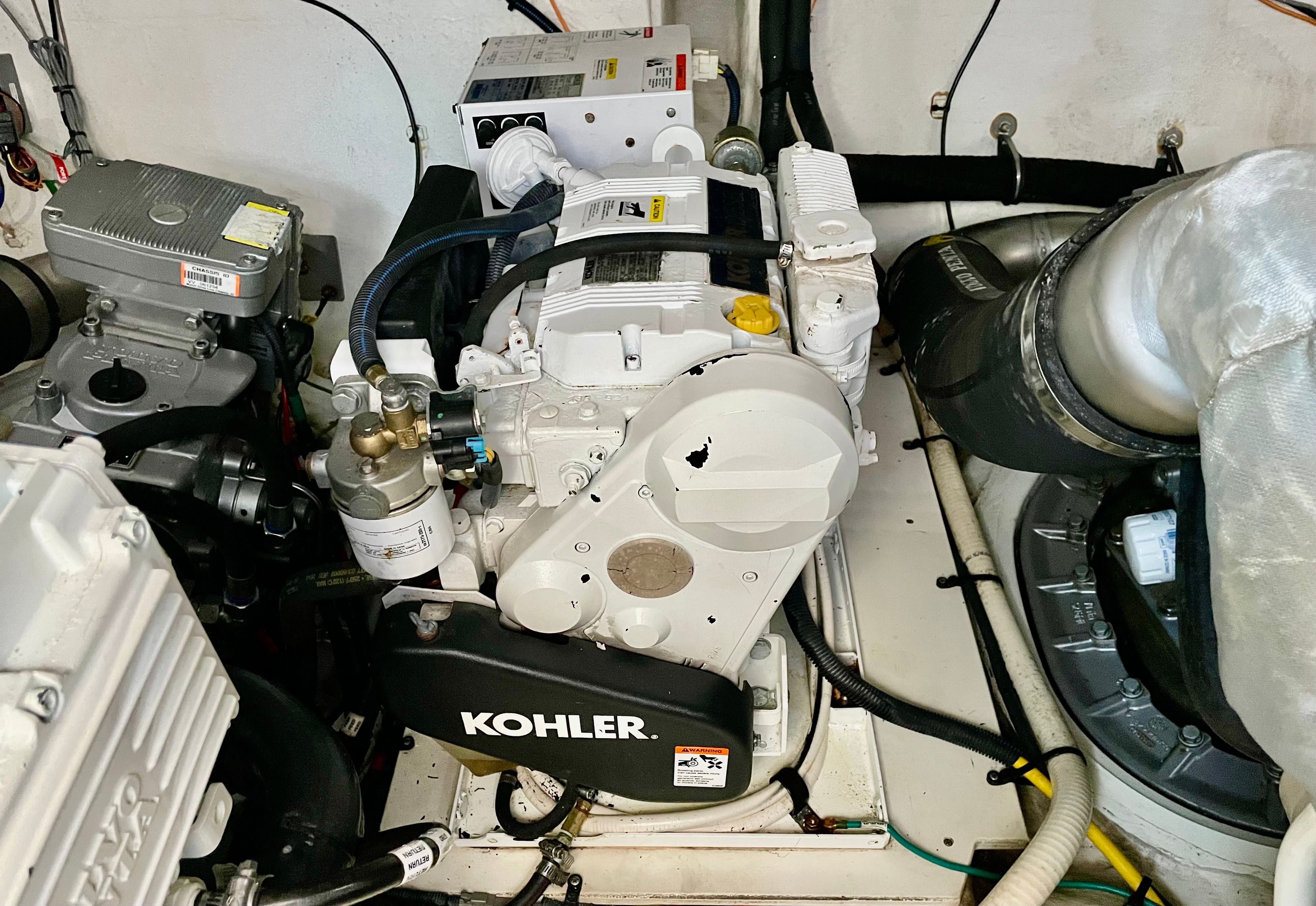 Engine room of a 2016 Cruisers Yachts 390 Express Coupe with Kohler generator.
