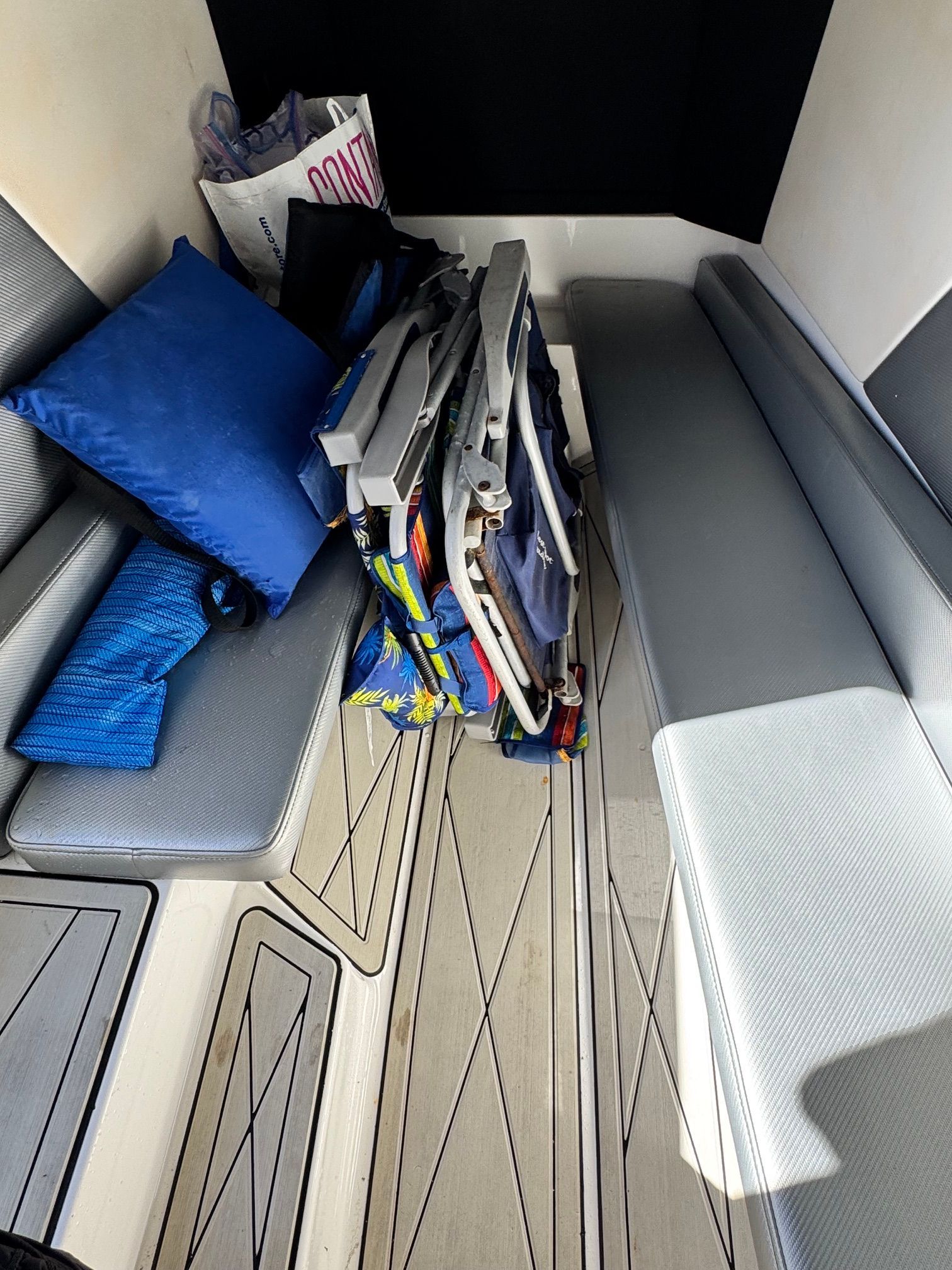 Interior of a 2017 Sunsation 32 CCX with benches and cushions.