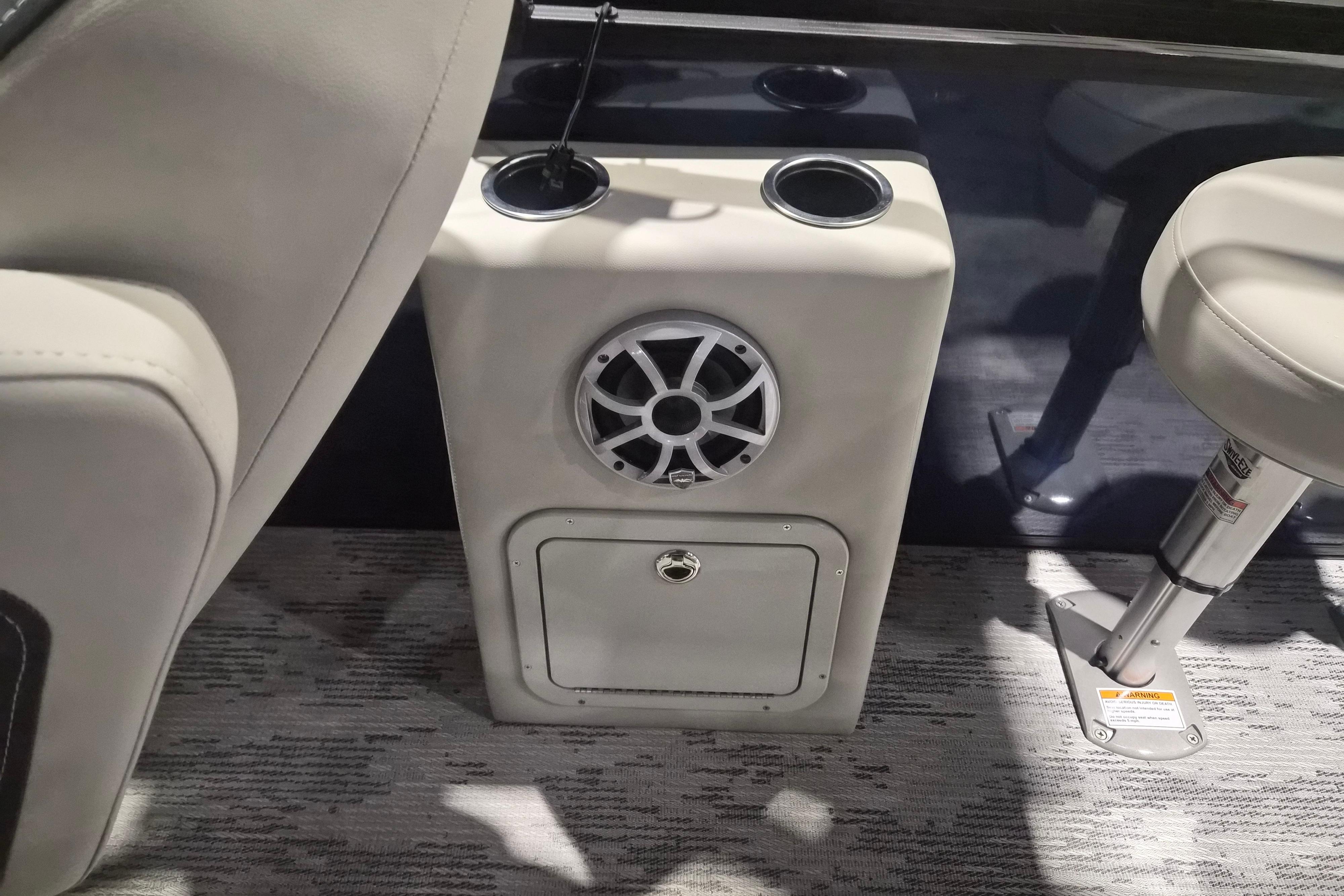 2026 Sylvan R-22 LZ DH boat interior with speaker and cup holders.