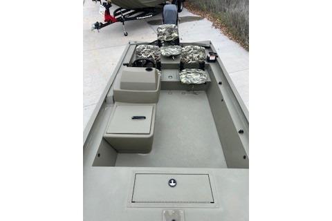 2026 Tracker Grizzly 1754 SC boat interior with camo seats and storage compartments.