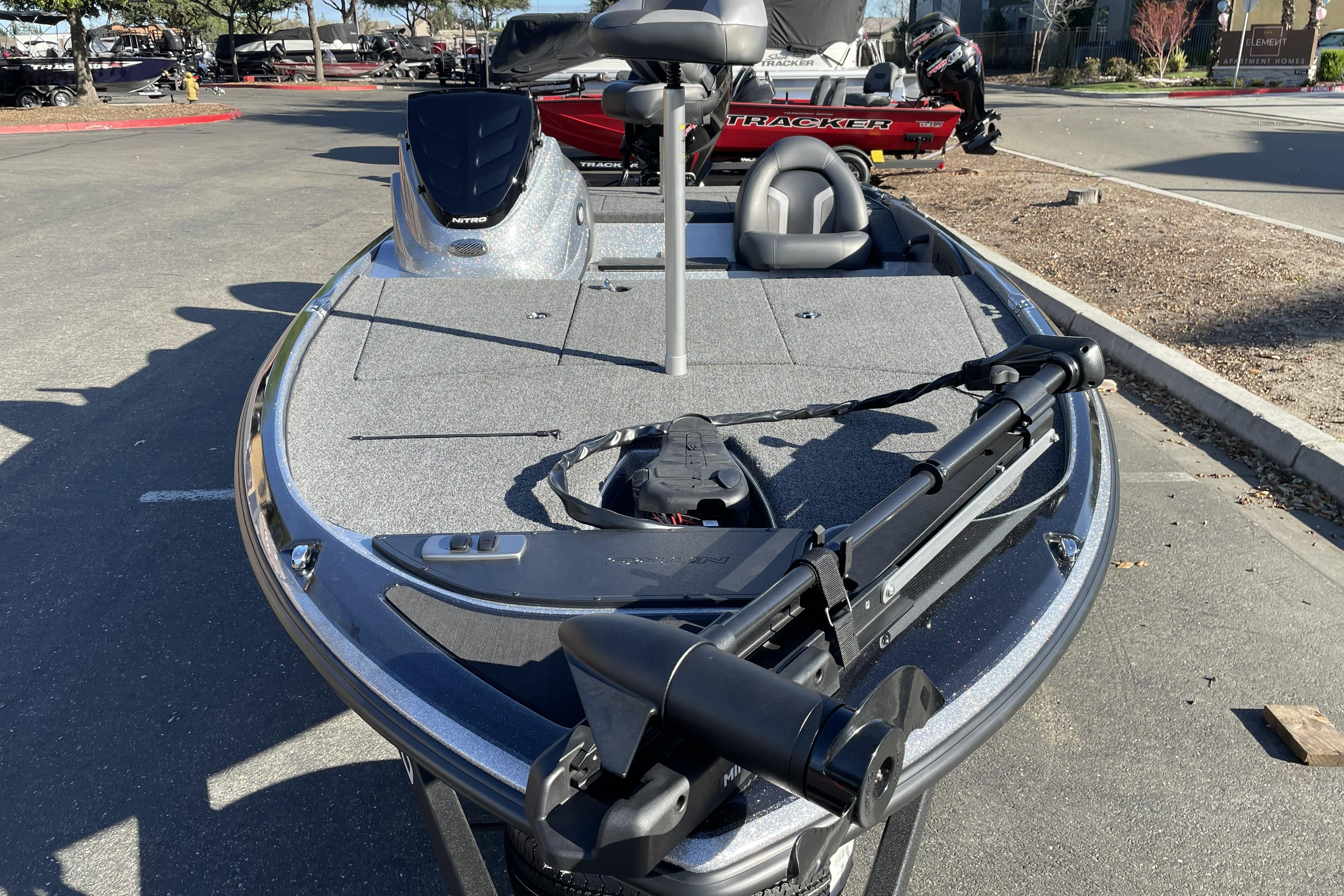 2026 Nitro Z17 fishing boat with trolling motor in a parking lot.