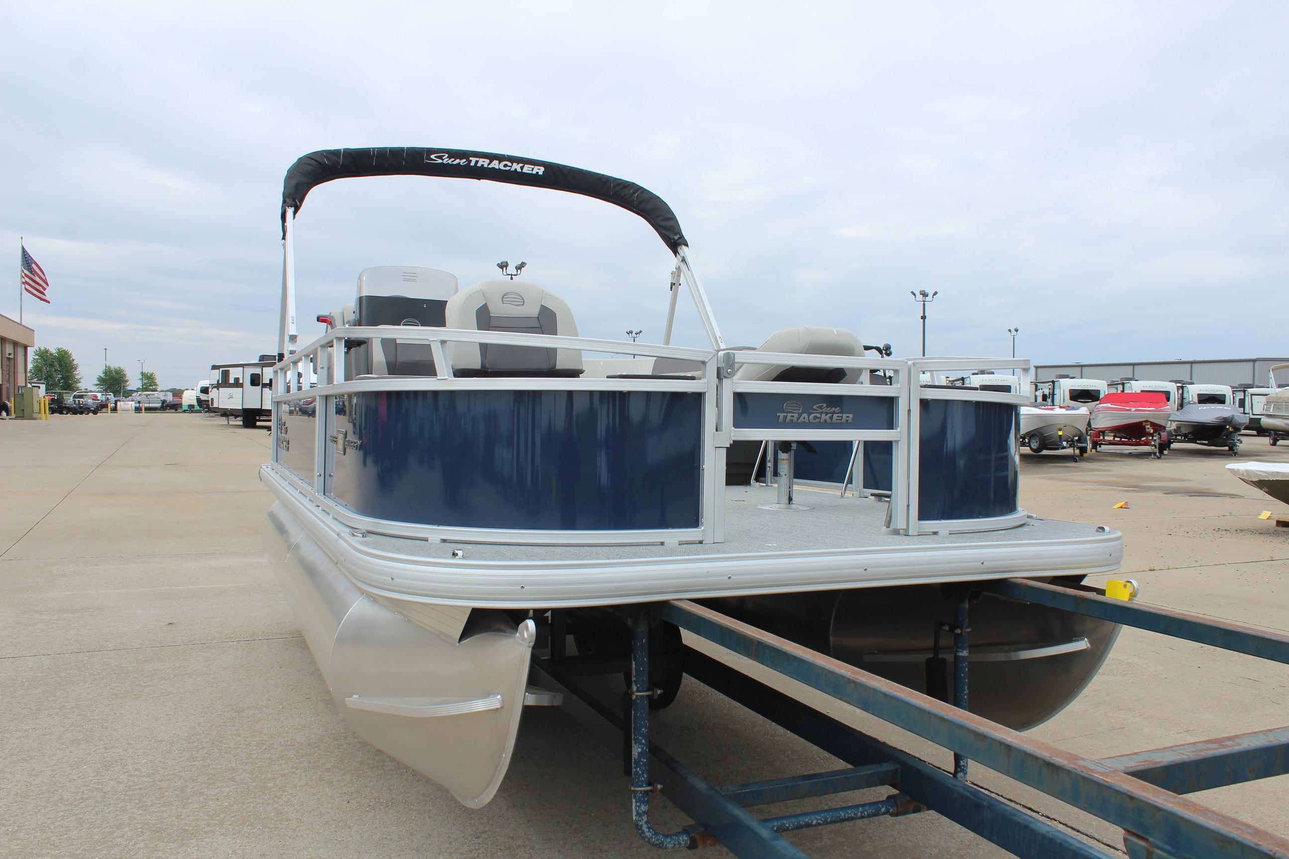 2026 Sun Tracker Bass Buggy 16 XL Select pontoon boat on trailer.