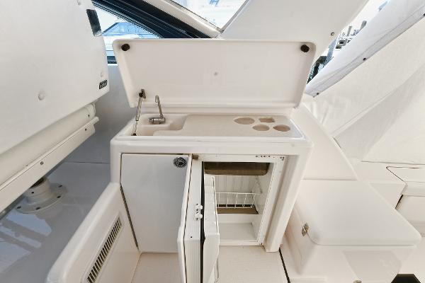 2008 Tiara Yachts 4200 Open boat kitchenette with sink and mini fridge.