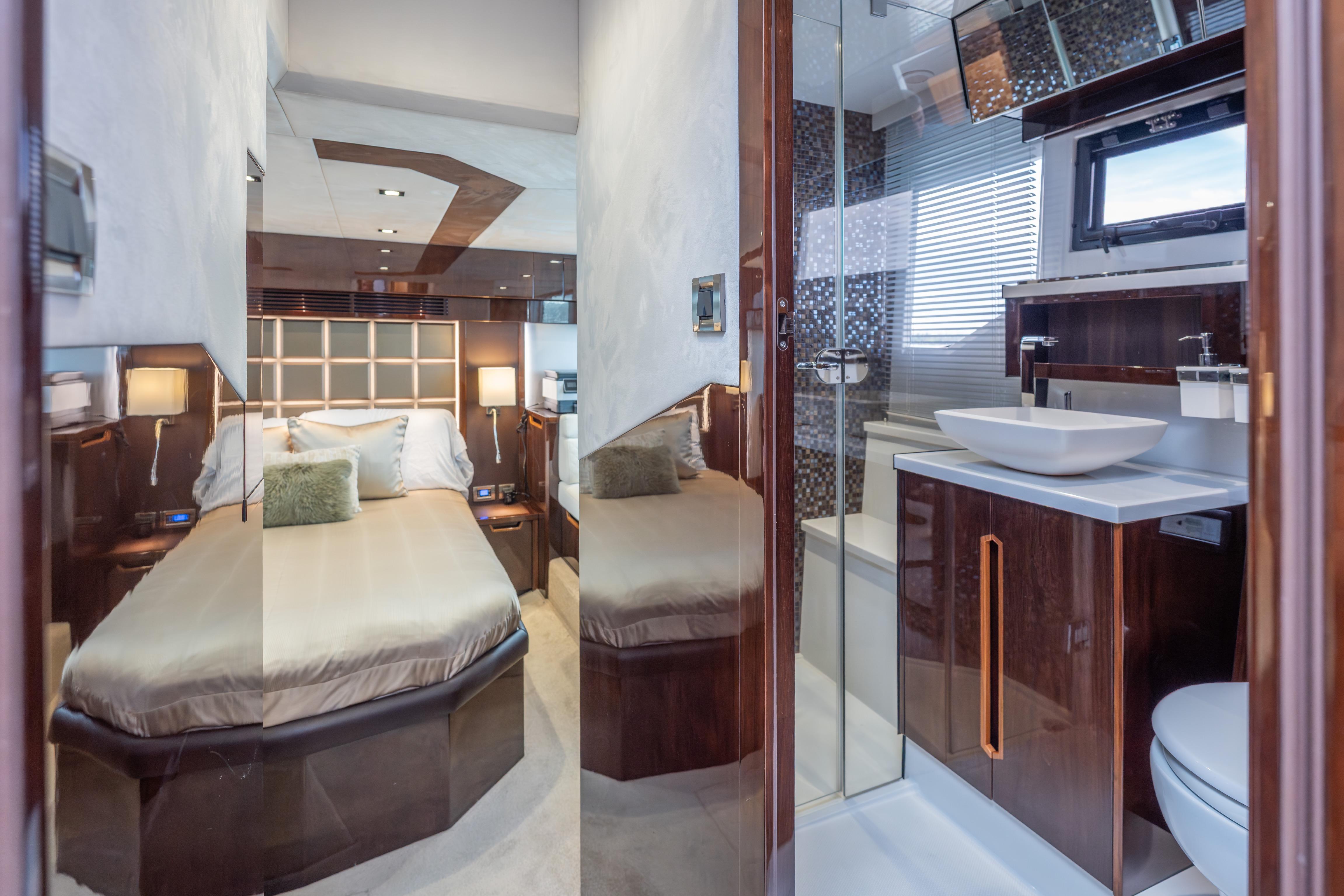Luxurious interior of 2020 Galeon 500 Fly yacht with bedroom and modern bathroom.