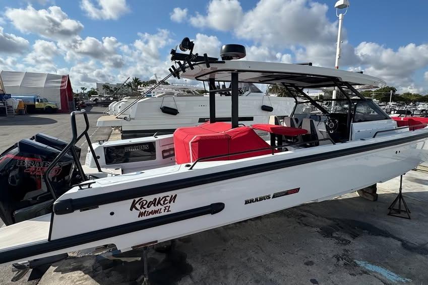 2023 BRABUS Shadow 900 ST boat with red seating, docked in Miami, Florida.