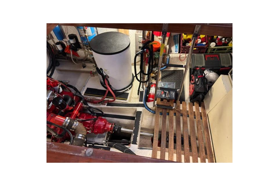 Engine room of 1986 Kadey-Krogen 42 boat with equipment and tools.