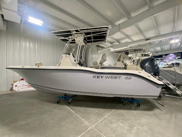 2024 Key West 219 FS boat in indoor showroom.