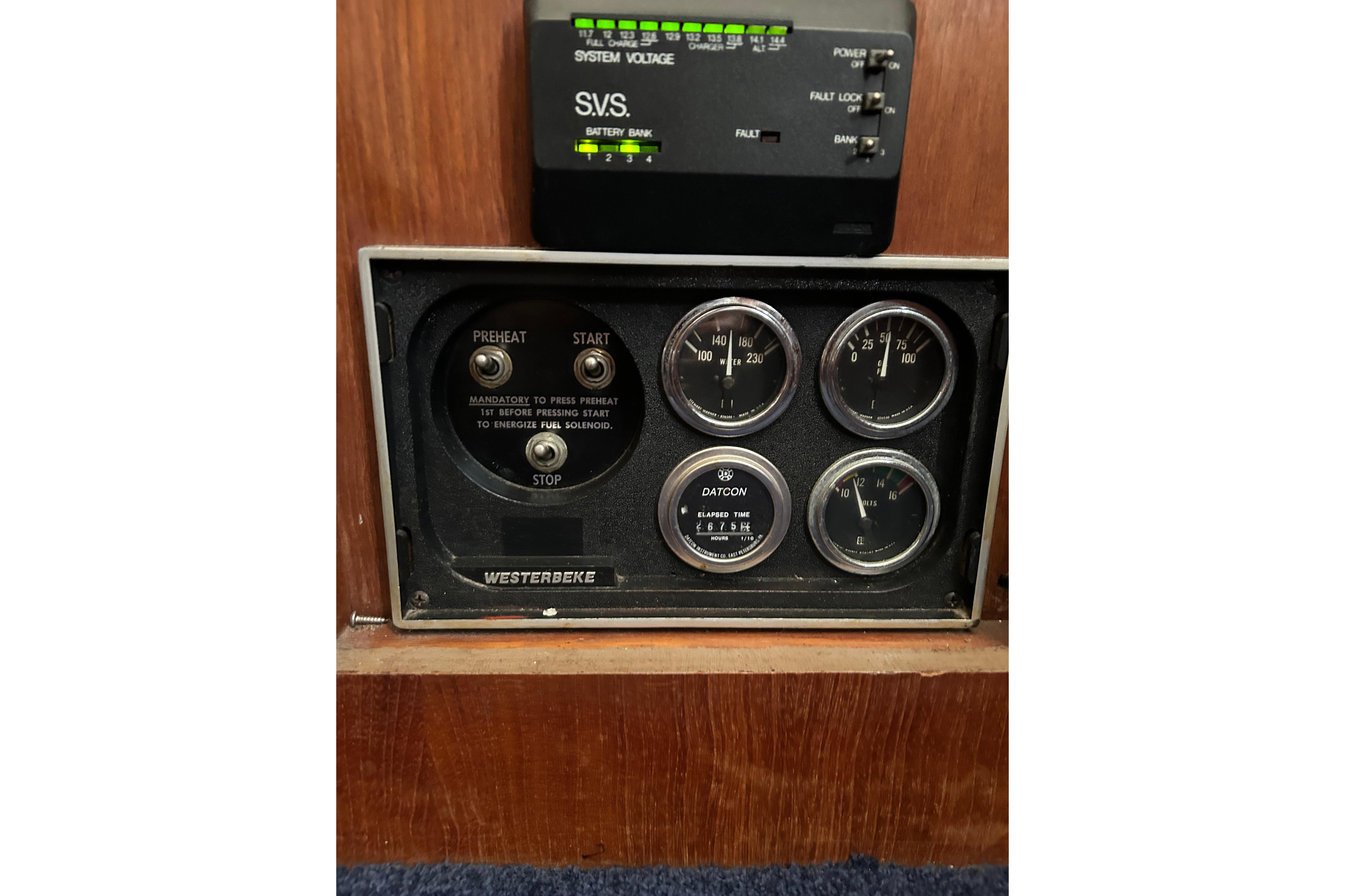 Control panel of a 1986 Viking 44 Motor Yacht with gauges and switches.