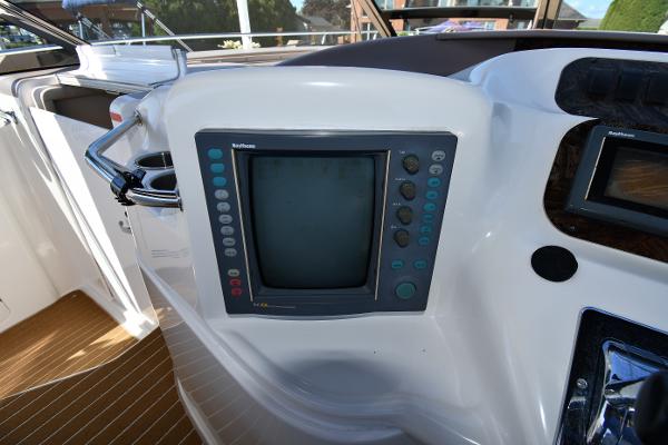 Control panel of a 1997 Sea Ray 400 Sundancer boat with navigation display.
