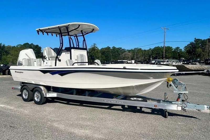2026 Ranger 2360 Bay boat on trailer, parked outdoors under clear blue sky.