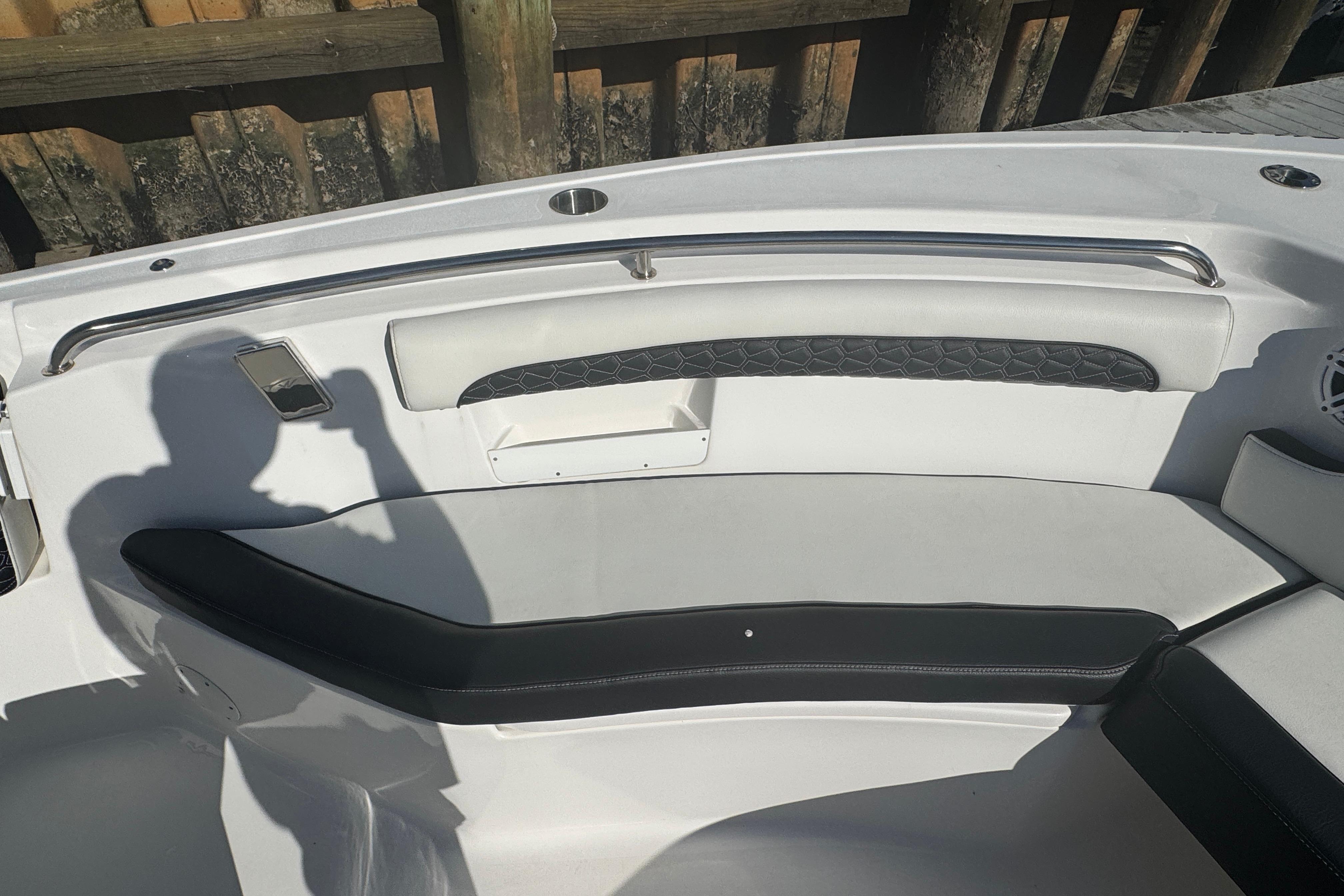 2025 Tidewater 232 LXF boat interior with cushioned seating and sleek design.