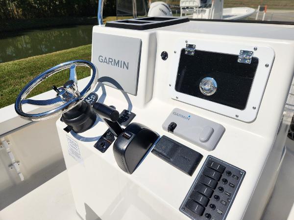 2023 May-Craft 208 CC boat console with Garmin navigation system and steering wheel.